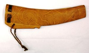 wooden knife sheath carved with Ainu patterns