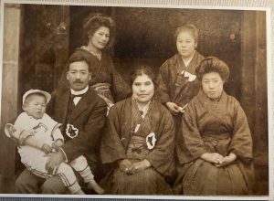 Old black and white photograph of 6 members of an Ainu family