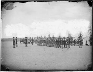 Photograph of 1860s Infantry standing at "Parade Rest"