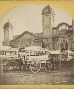 Photograph shows carriages in front of the South Ferry terminal, New York City, New York.