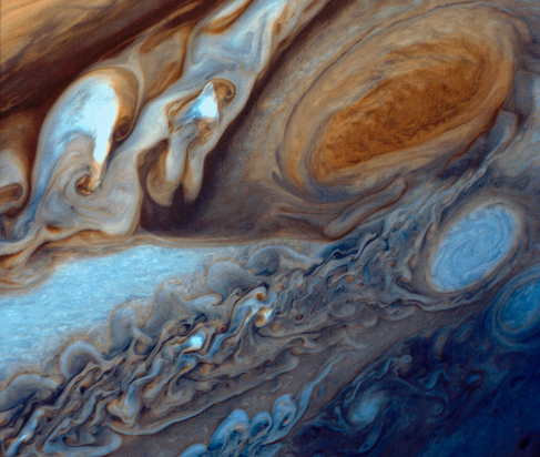 Jupiter’s Great Red Spot. A highly enhanced image from the Voyager probe showing the same region seen in Figure 11_01_Jupiter, but with much greater color contrast allowing much finer features and details to be discerned.