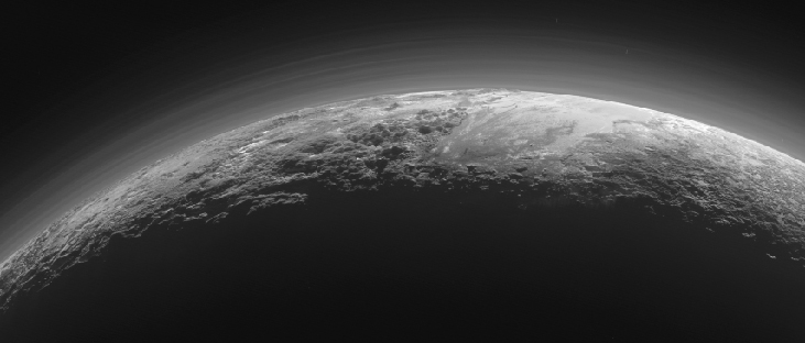 An image of a portion of the surface of Pluto edge-on, showing twelve layers of haze over the planet’s surface.