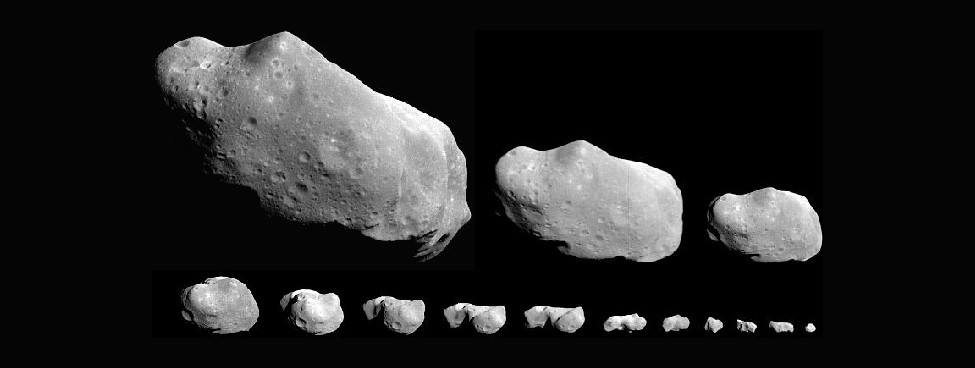 An image of several irregular shaped asteroids.