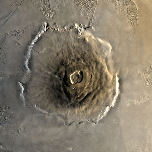 An overhead image of the volcano Olympus Mons on Mars, with a crater at the top.