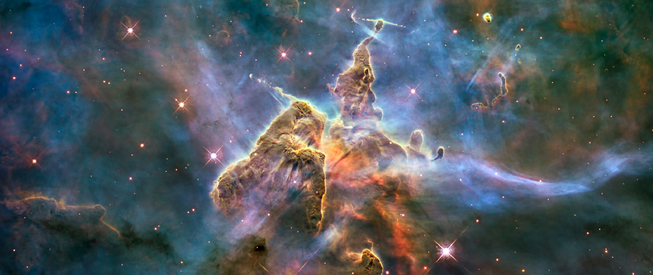 The Carina Nebula. This image shows two cone-shaped nebulae within the larger Carina Nebula. At the very top, or apex, of each gaseous “cone” are thin jets of material flowing into space at right angles from the cones.