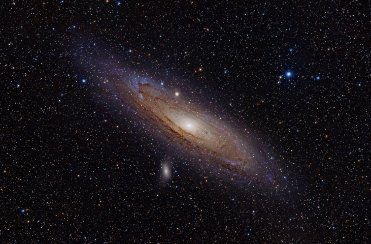 Visible Light Image of the Andromeda Galaxy (M31). The nearest large spiral galaxy to the Milky Way is slightly tilted from edge-on, allowing us to view the blue spiral arms as well as strong dust lanes that block some of the light from the central bulge.