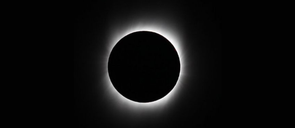 The Sun’s Corona. The black disk of the Moon covers the Sun allowing the faint streamers and delicate tendrils of the corona to be seen.