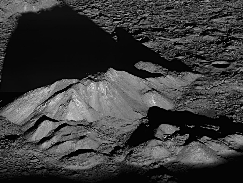 Sunrise on the Central Mountain Peaks of Tycho Crater. This compact mountain range casts a long shadow on the flat floor of Tycho in this image from the Lunar Reconnaissance Orbiter.