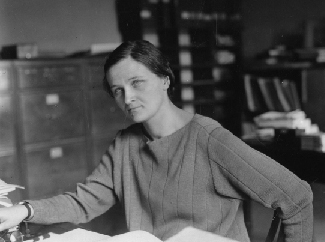 An image of Cecilia Payne-Gaposchkin seated at a desk.