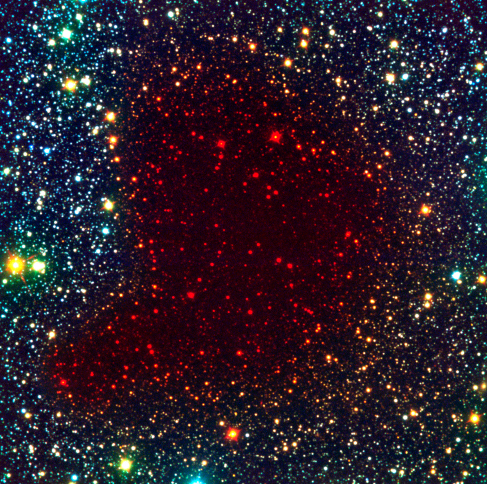 Barnard 68 in Infrared Light. The same comma-shaped region is shown here as in Figure 20_03_Cloud, but in this case stars are seen all across the nebula since long wavelength infrared light can penetrate the gas and dust of the nebula.