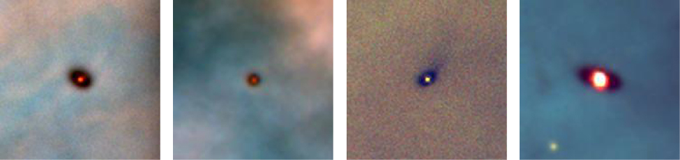 Four Hubble Space Telescope Images of Disks around Protostars in the Orion Nebula. Each image shows a dark, elliptical shape silhouetted against the bright glowing gas in the background. At the center of each ellipse is a bright reddish spot, indicating the location of the embedded protostar.