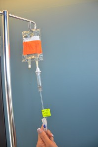 Open clamp on secondary IV line.