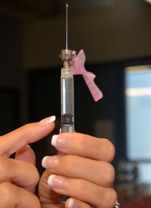Needle with safety cap