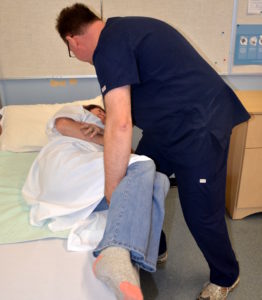 Positioning patient on the side of the bed