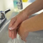 Rinse soap and water off hands