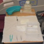 Gather supplies and set up sterile tray