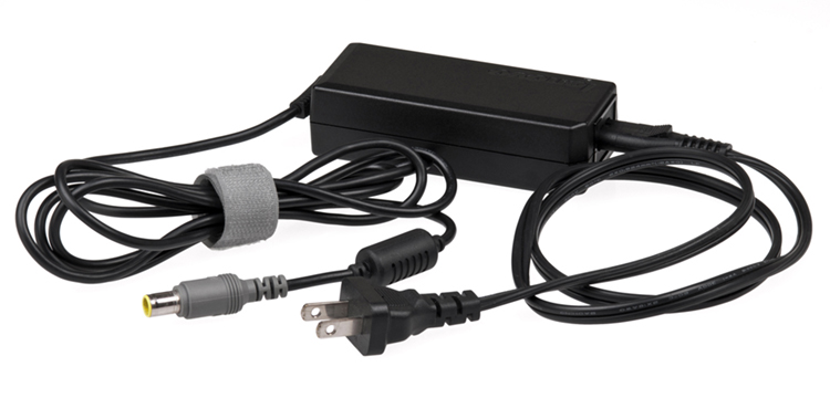 This black power charging unit connects a laptop to an electrical outlet, allowing the laptop to be charged up.