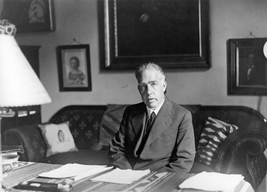 A photograph of Niels Bohr.