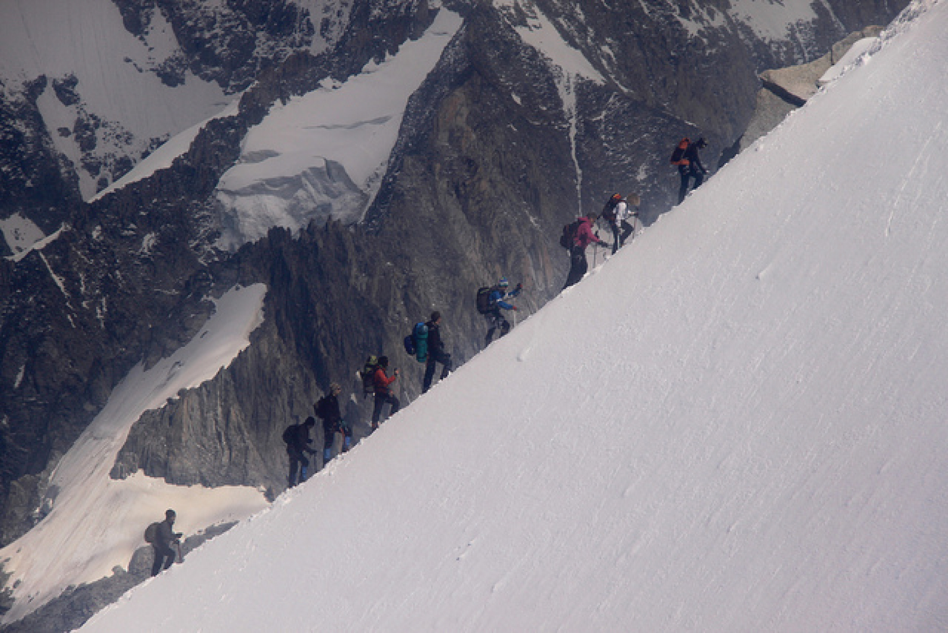 This photo shows a group of people climbing a mountain.