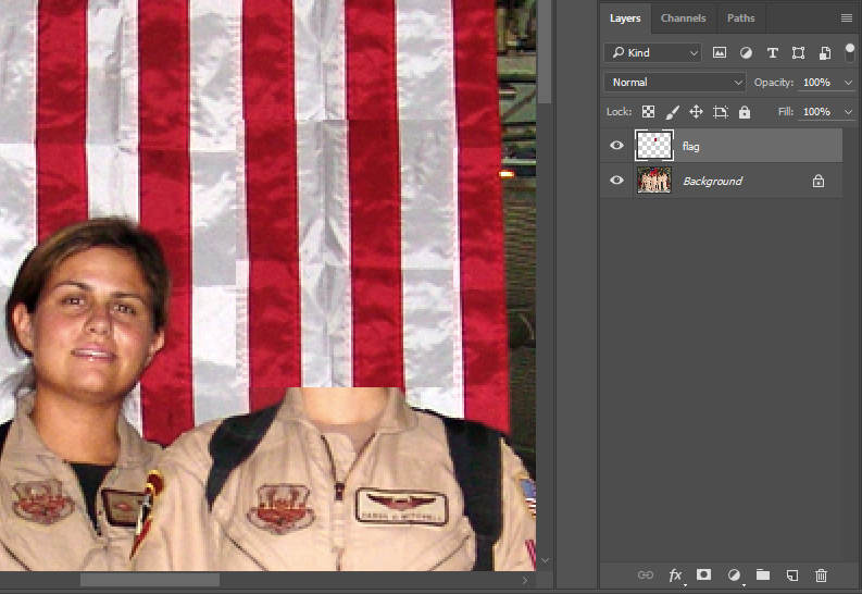 Image with section of flag copied over Capt. Mitchell's head.