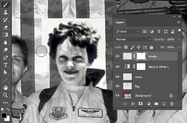 Screen capture showing a brush painting into the Amelia layer's layer mask to hide pixels.