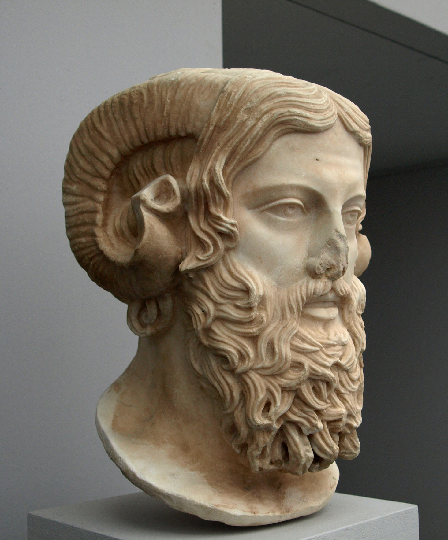The head of a statue of Zeus Ammon, a bearded man with culred ram's horns.