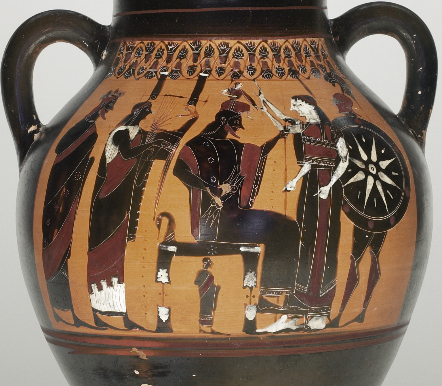 Zeus is throned. A small Athena, fully armed and armoured, leaps from his head. Other gods stand watching, including Ares bearing a large shield and wearing a plumed helm.