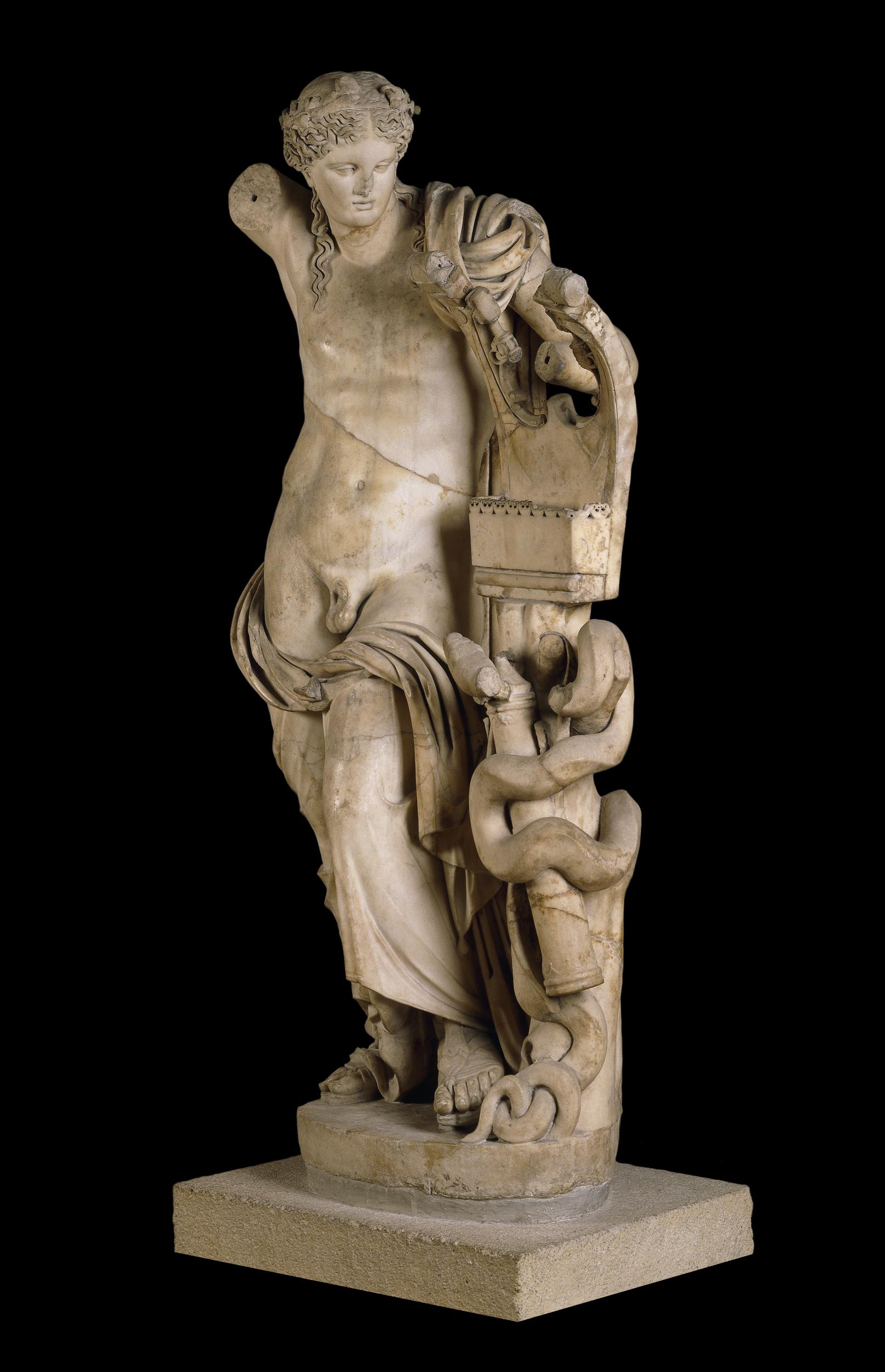 Apollo, a long-haired youth, holding a kithara and a quiver of arrows. He is nude, except for some cloth draped around his legs.