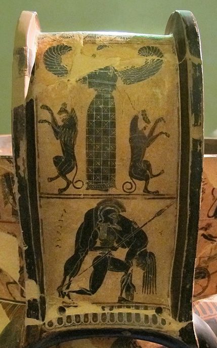 Ajax, a warrior with a plumed helm and spear, carries the body of dead Achilles draped over his shoulder. On a second level, above, stands a winged Artemis, accompanied by two dog-like animals.