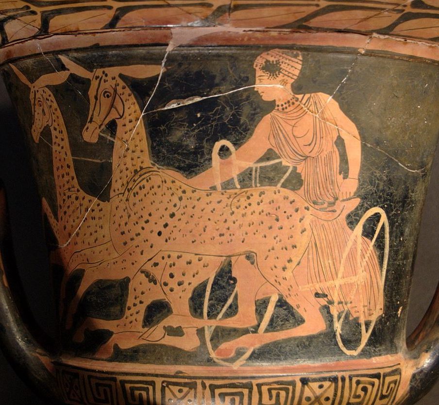 Artemis, with jewels and a fancy hat, sits in a chariot pulled by two spotted hinds.