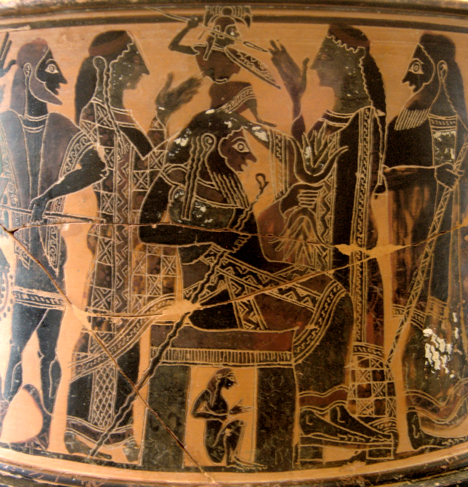 Zeus seated, with the small figure of Athena emerging from his head with a helm, shield, and spear. Other gods stand around Zeus.