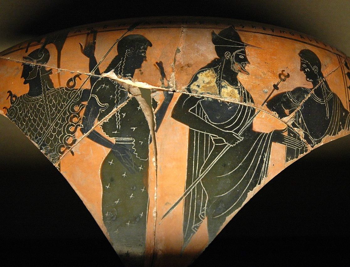 Hermes stands between Athena, Hera, and Aphrodite.