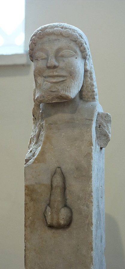 A Herm: a rectangular block of marble with the head of Hermes atop it. On the centre of the block is an erect penis.