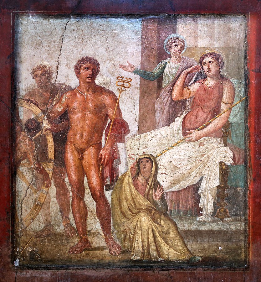 Hera sits on a throne, with Iris standing beside her. In front of Hera is Hermes, a naked young man with a scepter. Hermes has one hand on a large wheel (partly out of frame), to which is strapped Ixion. Hephaestus stands behind Hemes. A young woman with her head veiled sits at Hermes' feet.