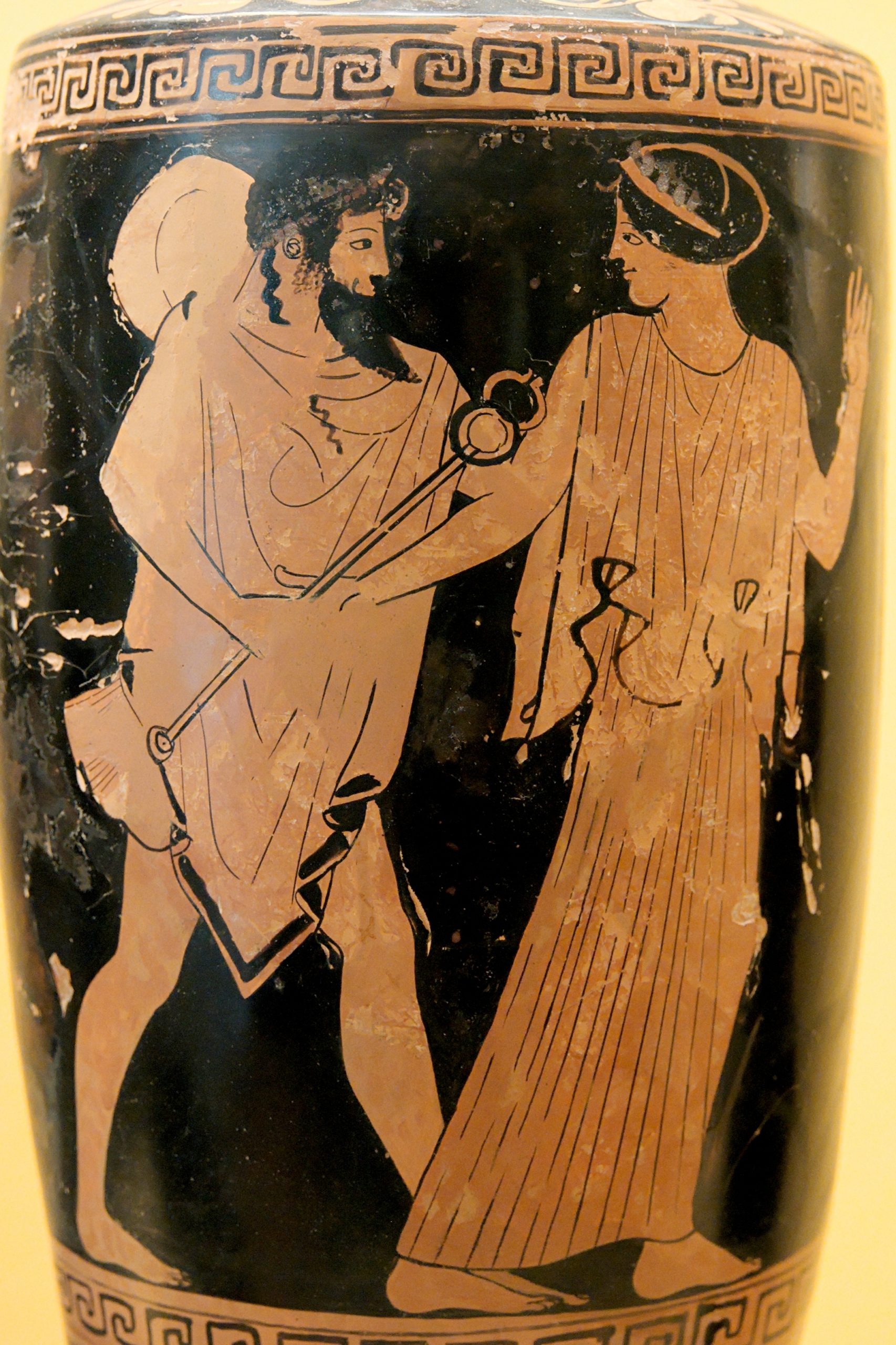 Hermes, a bearded man, grabs the arm of a young woman.