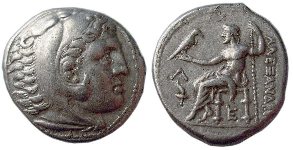 Side 1: the head of Alexander the Great wearing a lion skin cap. Side 2: Zeus throned with a scepter and eagle.