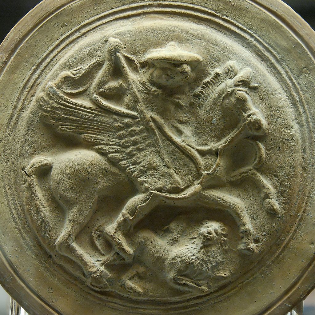 Bellerophon riding Pegasus and wearing his hat. He stabs down at Chimera.