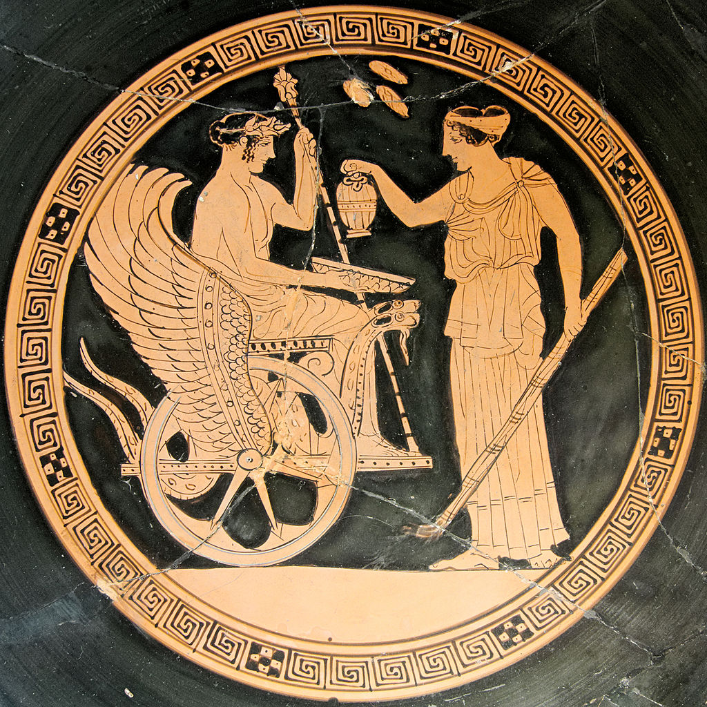 Triptolemus, holding a staff in one hand and a bowl in the other, sits in a winged chariot. Persephone stands before him, pouring a libation into his bowl and holding a torch.
