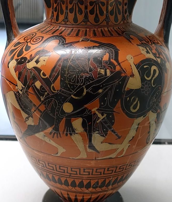 Heracles, with the lion skin tied around him, wields a shield and sword. Three amazons with helms, shields and spears fight him.