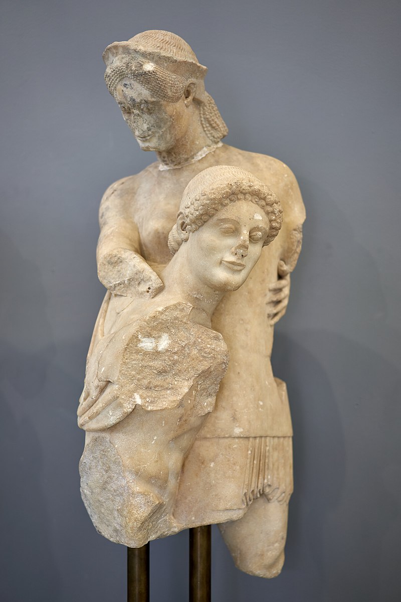 Theseus, long-haired and wearing a hat, holds Antiope. Both figures are heavily damaged.
