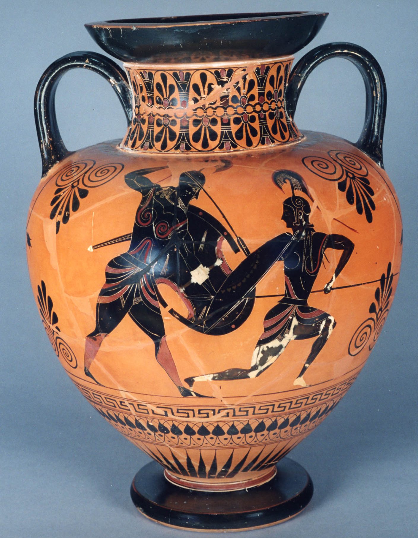 Achilles, with shield and helm, stabs at Penthesilea with a spear. Penthesilea, with spear, helm, and shield, falls away from Achilles but has her head turned back to look at him.