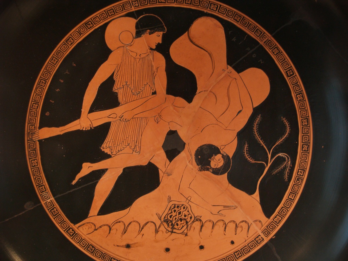 Theseus, in a tunic and wearing a petasos hat around his neck, holds Sciron by the leg and throws him. Below Sciron are wave patterns, and a turtle.