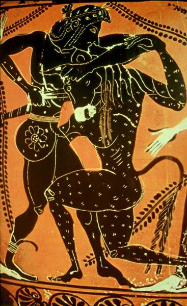Theseus, in a laurel crown, holds the minotaur in a headlock and stabs it with his sword. The Minotaur is down on one knee.