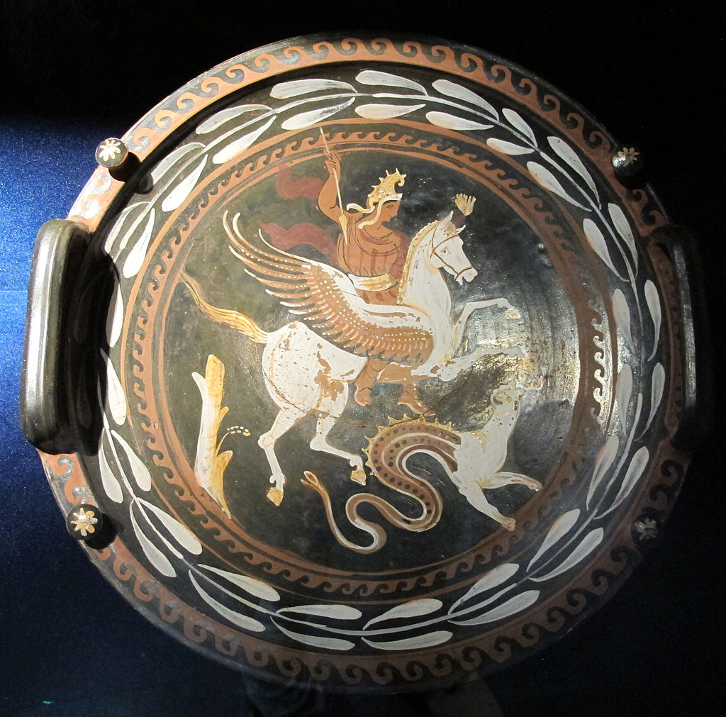 Bellerophon, wearing a cape and Phrygian cap, riding Pegasus. He has a spear raised to stab down at the chimera, depicted with a snake tail.