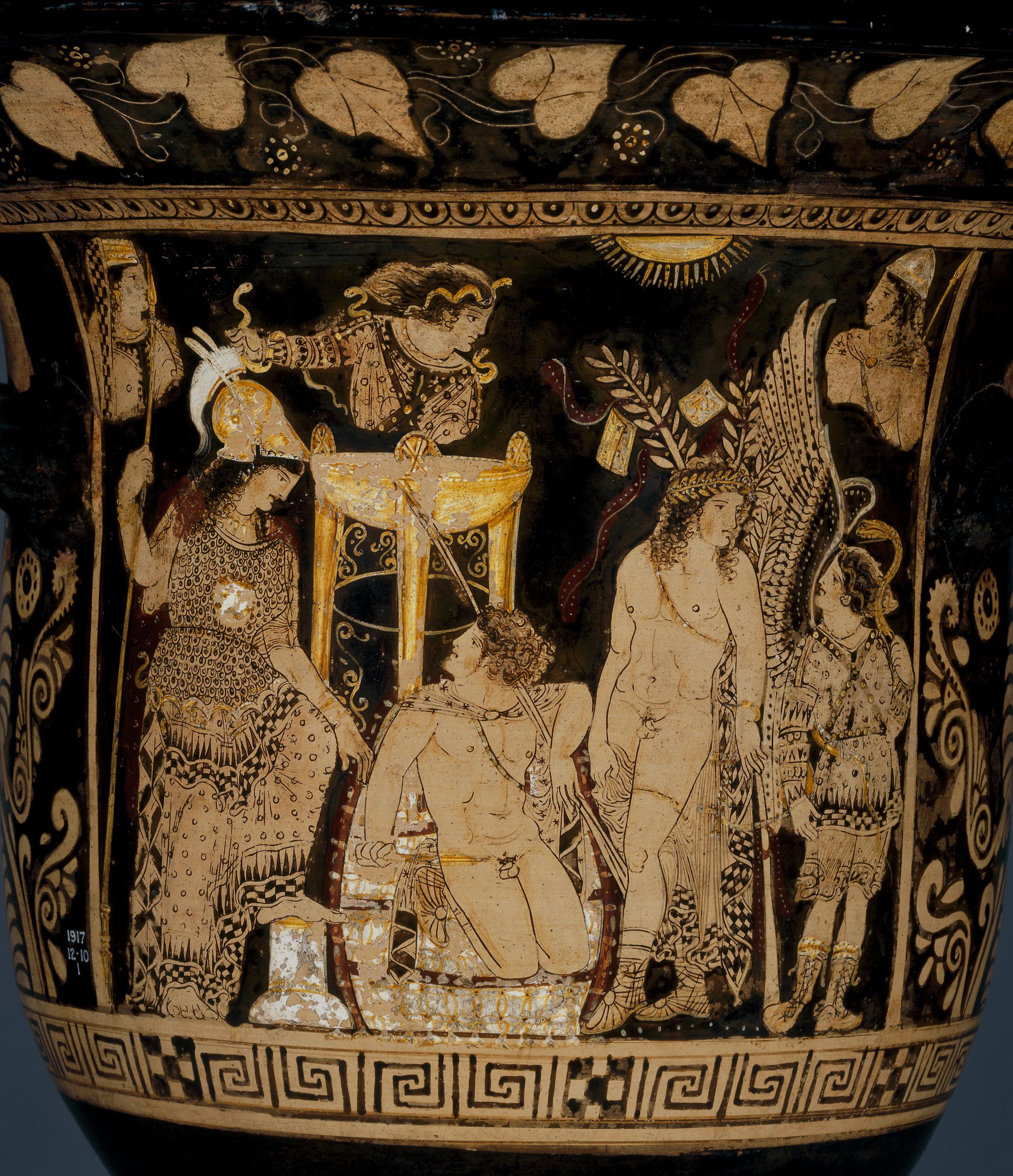 Orestes, nude with chlamys cape and a spear, kneels in from of the delphic tripod and looks up at Athena. Athena, in helm and aegis, stands on his left. Apollo, nude wearing laurels, stands on his right. Two female figures, one with wings and one covered in snakes, are at the edges of the scene.