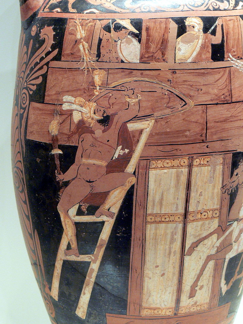 Campaneus, a nude bearded man in a plumed helm and chlamys cape, climbs a ladder onto the walls of Thebes. He holds a shield and weapons. Two men stand on the ramparts above, with spears and shields.