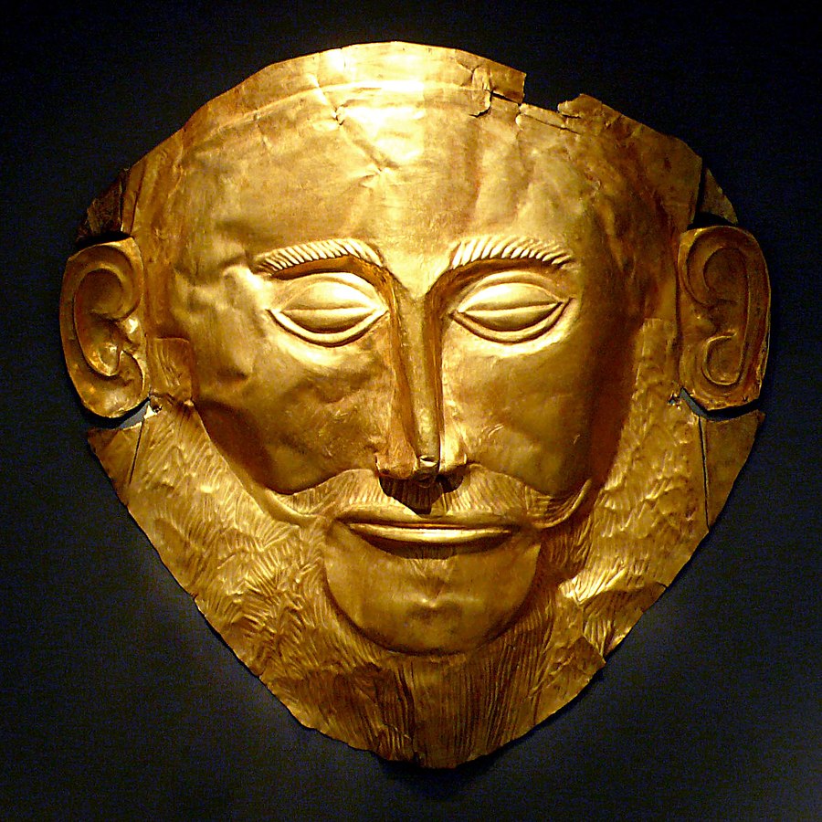 A gold mask embossed with a bearded face.