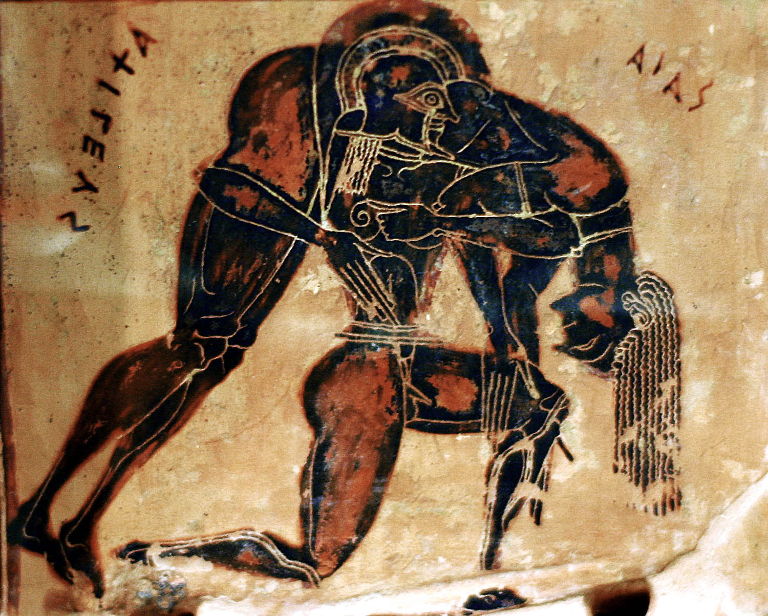 Ajax, on one knee in an archaic running pose, holds the body of Achilles over his shoulders. Achilles is nude and unarmoured. Ajax wears only a plumed helm and greaves.