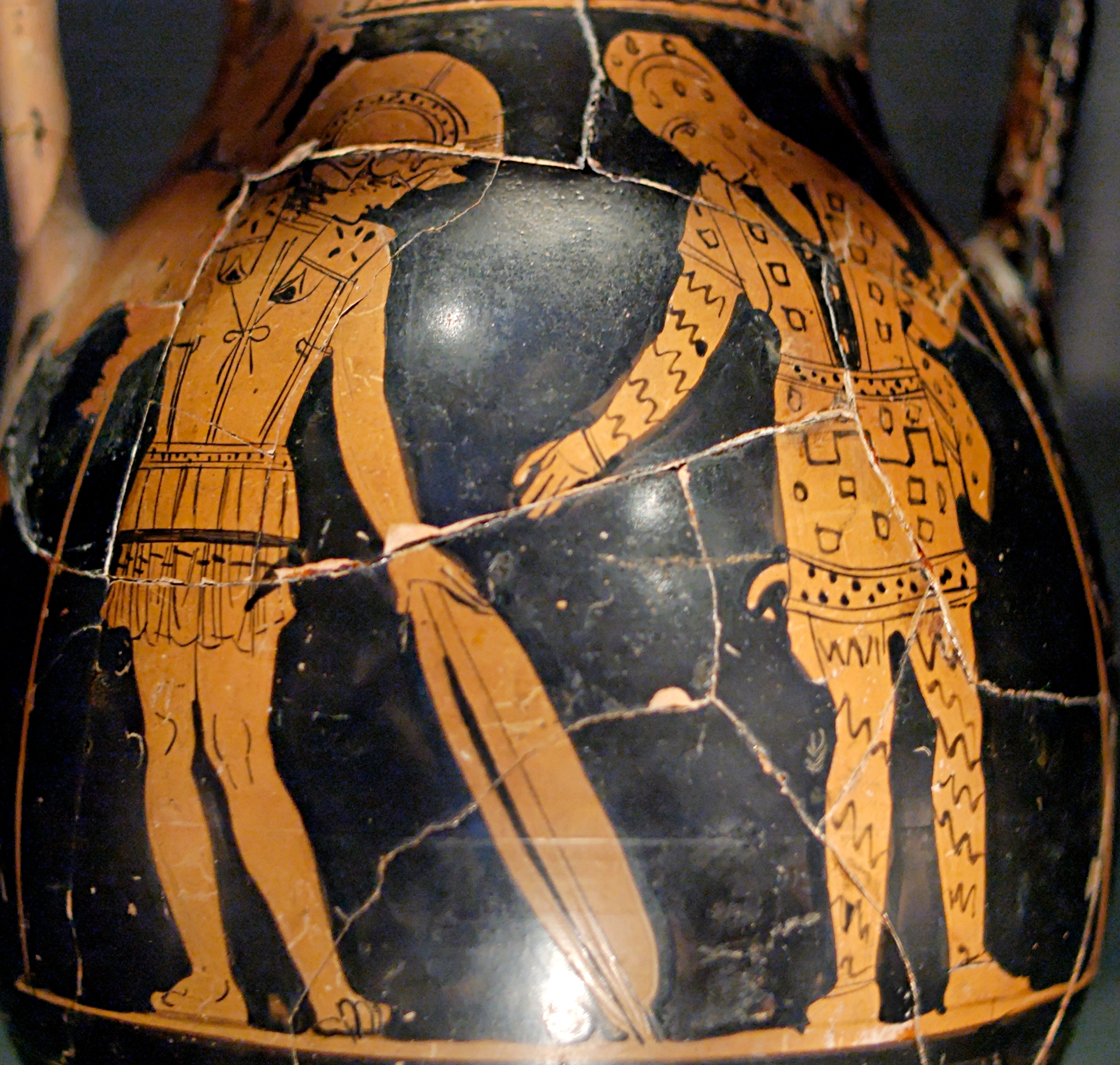 Diomedes passes a shield to Glaucus. Diomedes wears tunic-like Greek armour and a helm, while Glaucus wears a patterned tunic, headdress, and leggings. Both carry spears.