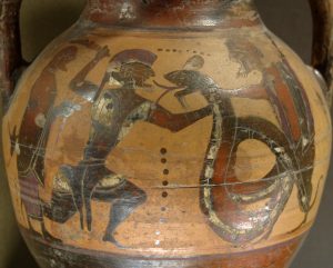 Cadmus, wielding a sword and wearing a plumed helm, lunges at the dragon in an archaic running pose. The dragon, snake-like, has its tongue out. Another figure stands behind the dragon and holds it by the neck, and another stands behind Cadmus.